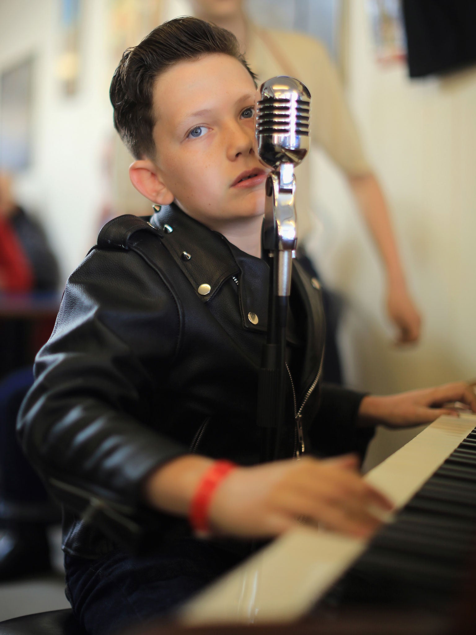 Rock and Roll pianist and singer Lewis Jordan Brown, aged 11, entertains devotees at the 50th Hemsby Rock 'n' Roll Weekender