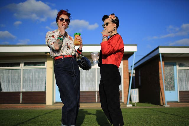 Rock and Roll devotees Lori Barker, left, and Yvette Hillebrandt, right, pose as they attend the 50th Hemsby Rock 'n' Roll Weekender as the biannual festival celebrates 25 years