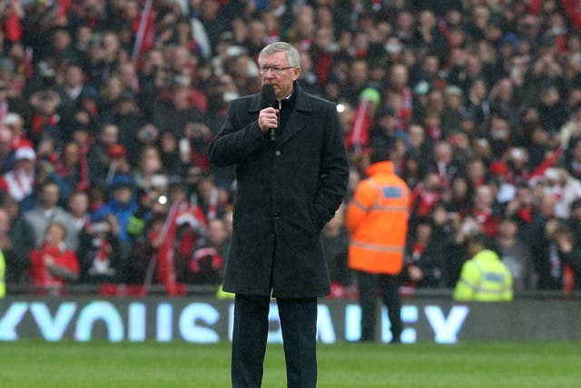 Sir Alex Ferguson addresses the onlooking Manchester United crowd