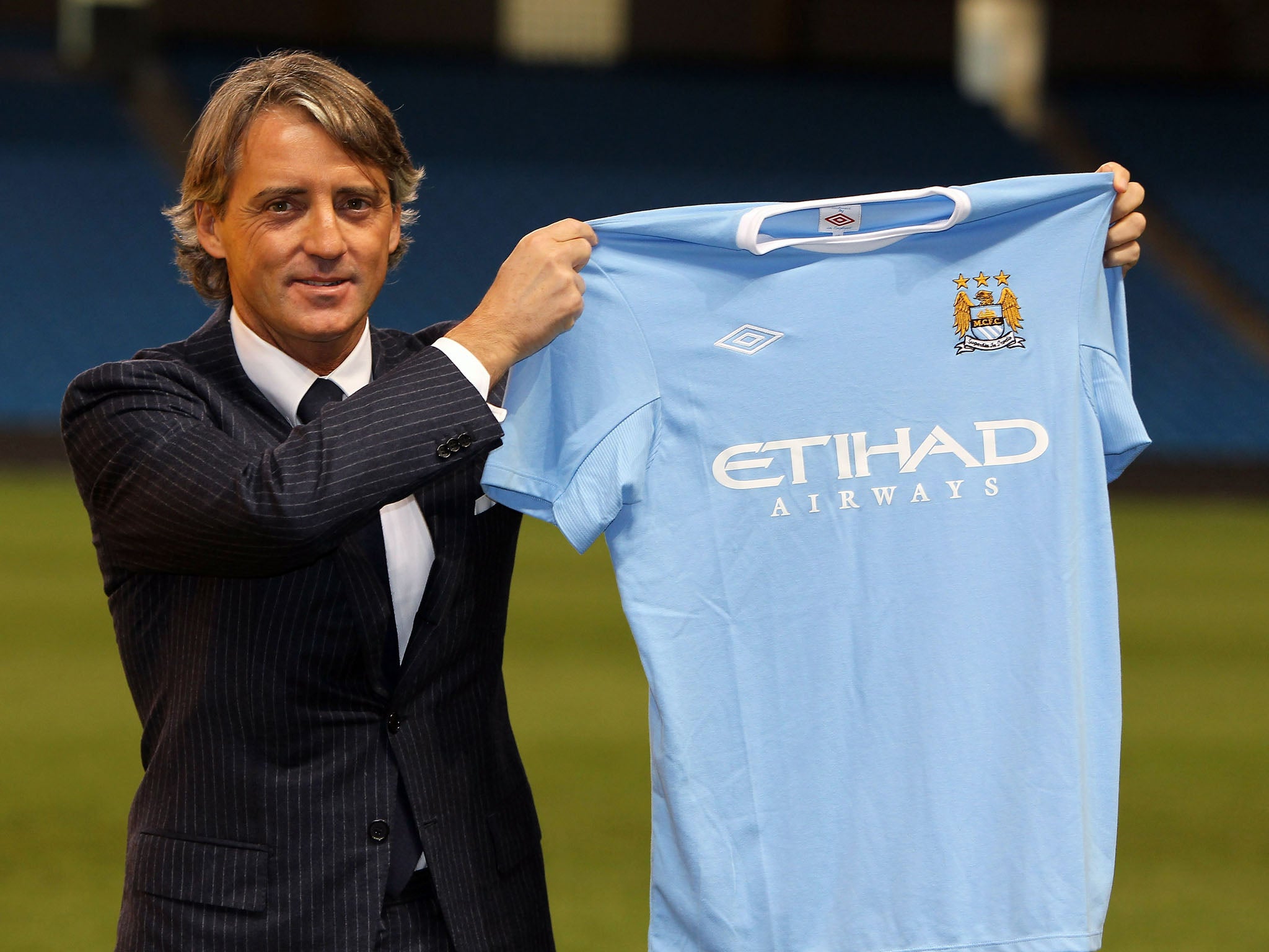 21 December 2009: Roberto Mancini is unveiled as the Manchester City manager, replacing Mark Hughes. The team won his first four games in charge (Alex Livesey/Getty Images)