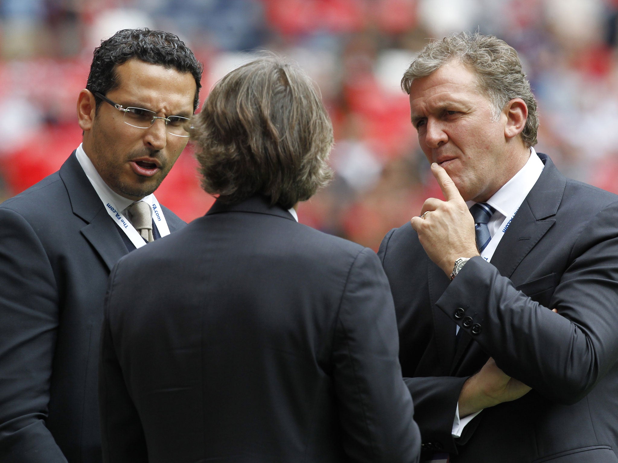 Manchester City’s chairman, Khaldoon al-Mubarak, left, and former chief executive Garry Cook in discussion with Roberto Mancini