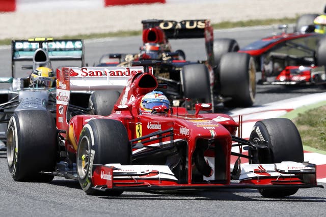 Fernando Alonso gets ahead of Lewis Hamilton on the first lap