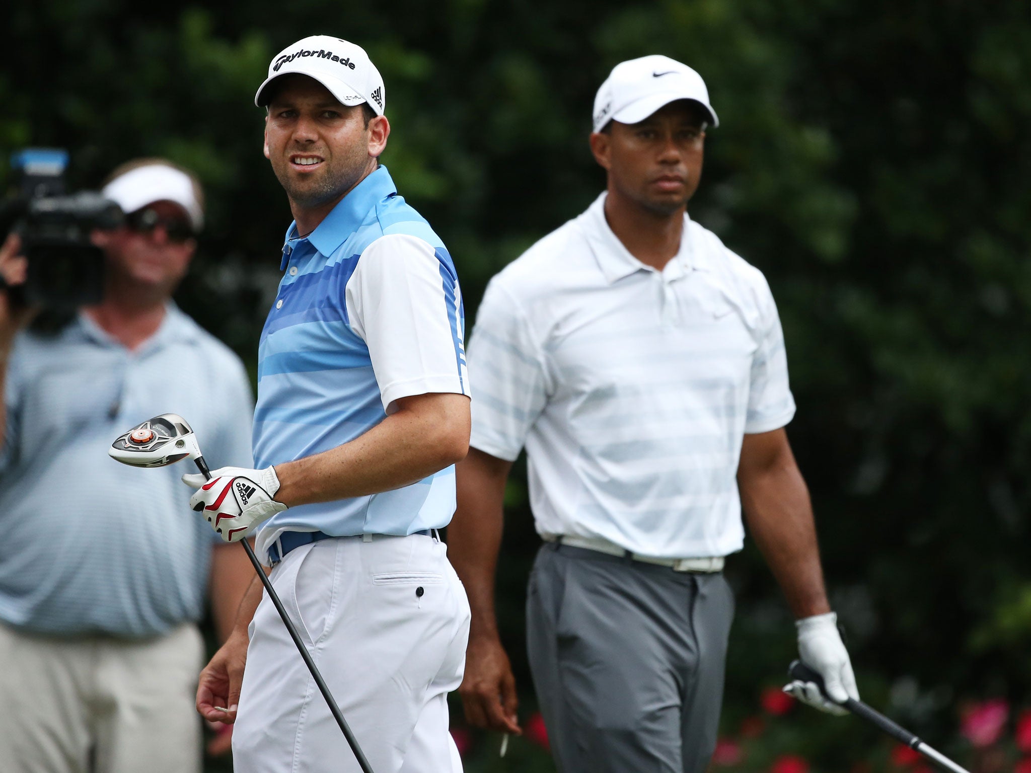 Sergio Garcia, left, and Tiger Woods, right, had another frosty round