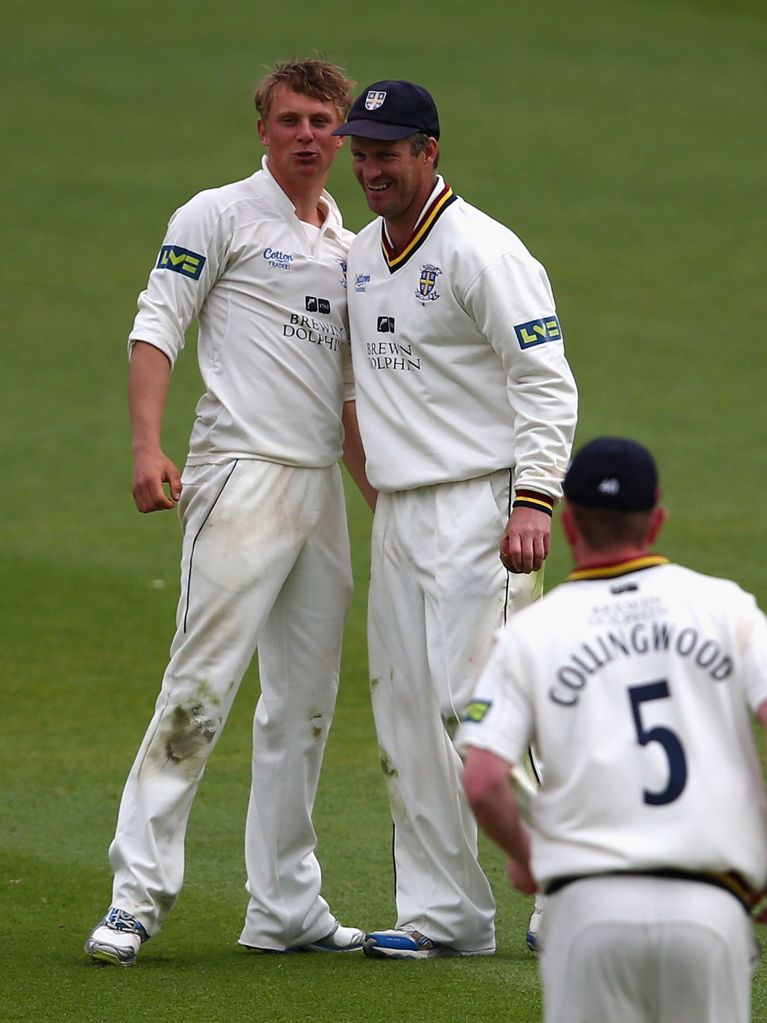 Scott Borthwick, left, celebrates taking another Surrey wicket