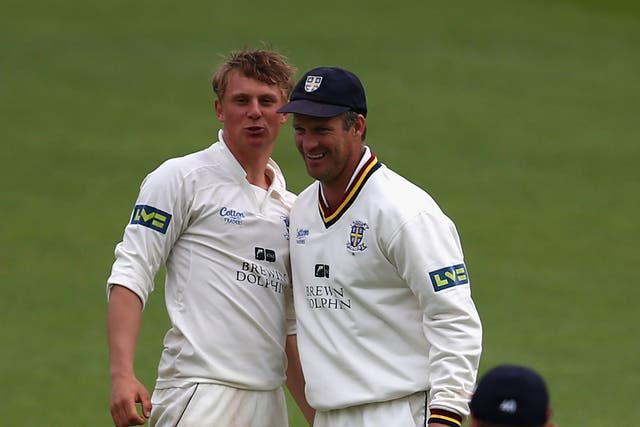 Scott Borthwick, left, celebrates taking another Surrey wicket