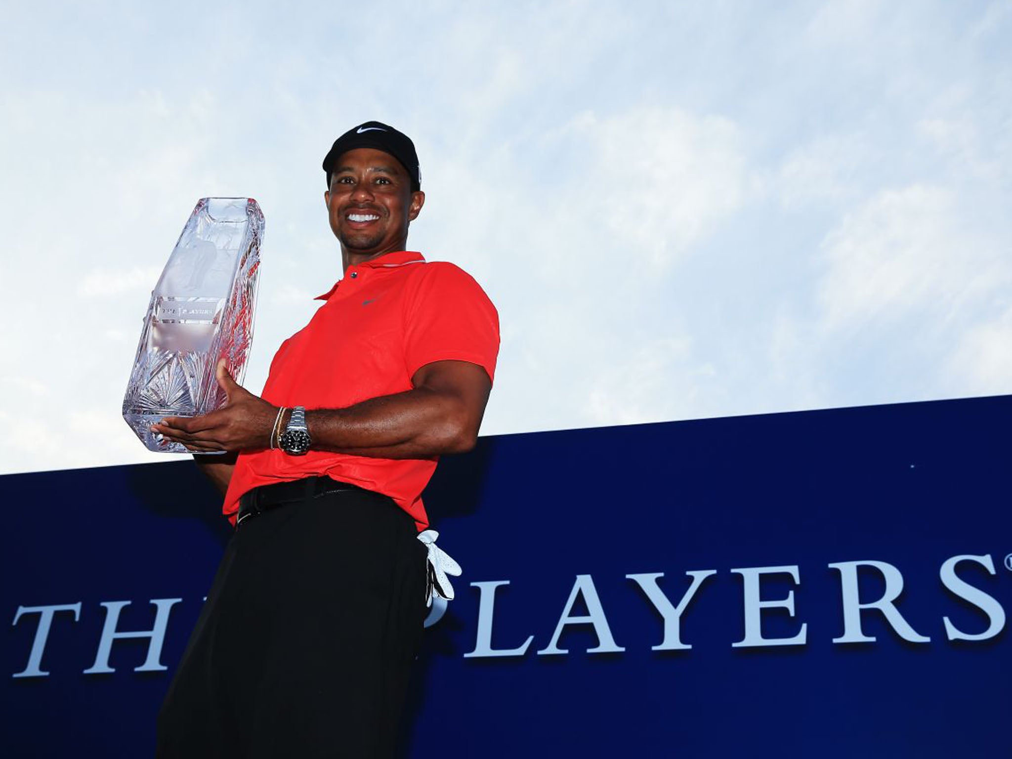 Tiger Woods holds the winner's trophy after the final round of The Players Championship (Richard Heathcote/Getty Images)