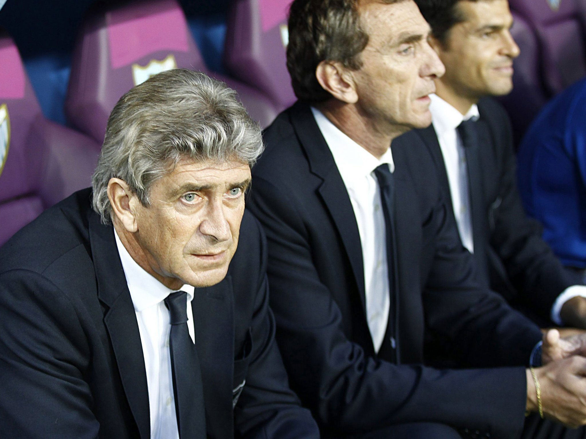'No deal': Manuel Pellegrini sits in the Malaga dugout last night