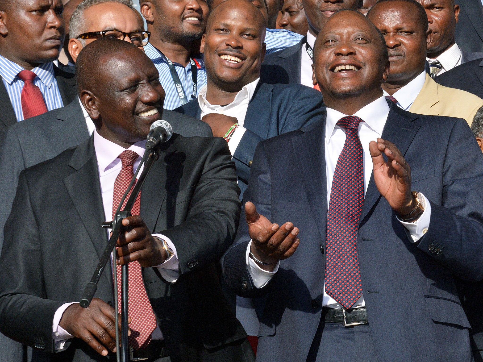 Newly elected President Uhuru Kenyatta (R) and running mate William Ruto (L) are pictured, following his victory in Kenya's national elections in Nairobi on March 9, 2013. Kenyatta will face charges at the International criminal court in July 2013.