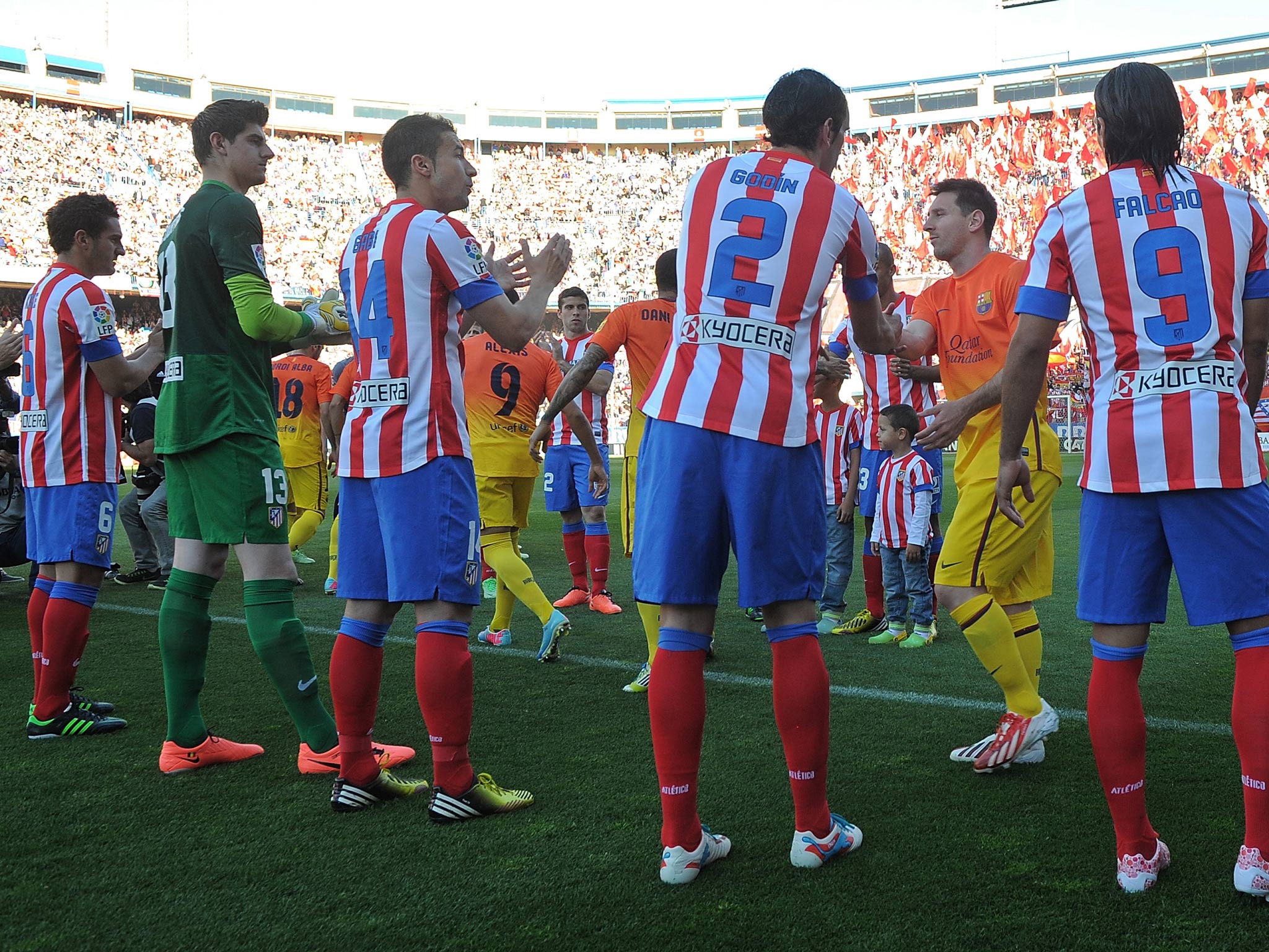 Atletico Madrid players congratulate Lionel Messi and Barcelona after the Catalans were proclaimed La Liga champions