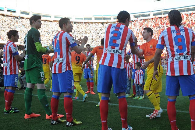Atletico Madrid players congratulate Lionel Messi  and Barcelona after the Catalans were proclaimed La Liga champions 