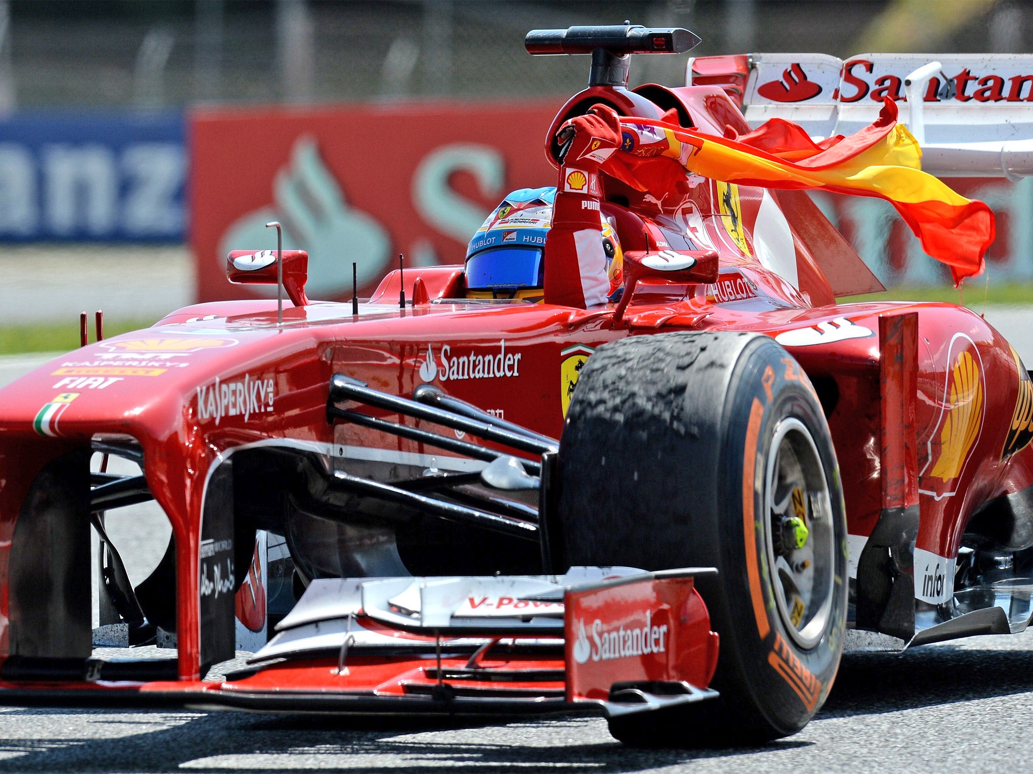 Fernando Alonso after winning the Spanish Grand Prix on Sunday, with a battered front tyre clearly visible