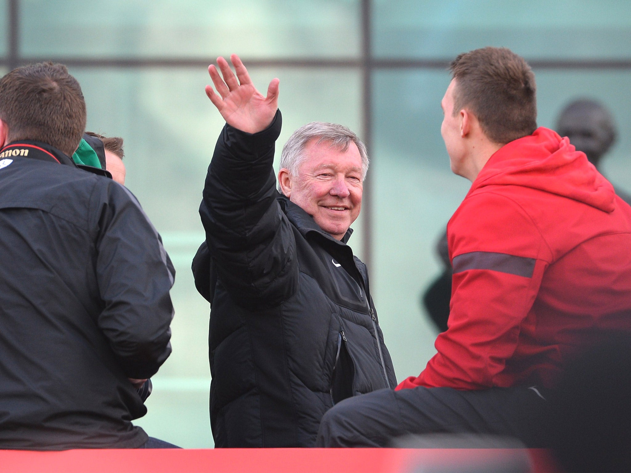 Retiring on top: Alex Ferguson waves to the Manchester United faithful