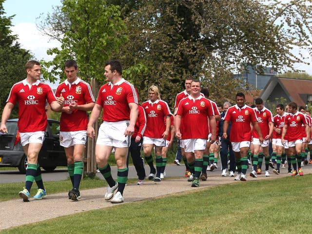 The Lions squad walking through Syon Park in London yesterday after getting their tour kit