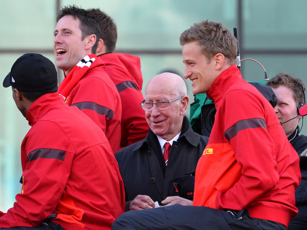 Bobby Charlton joins in with the celebrations