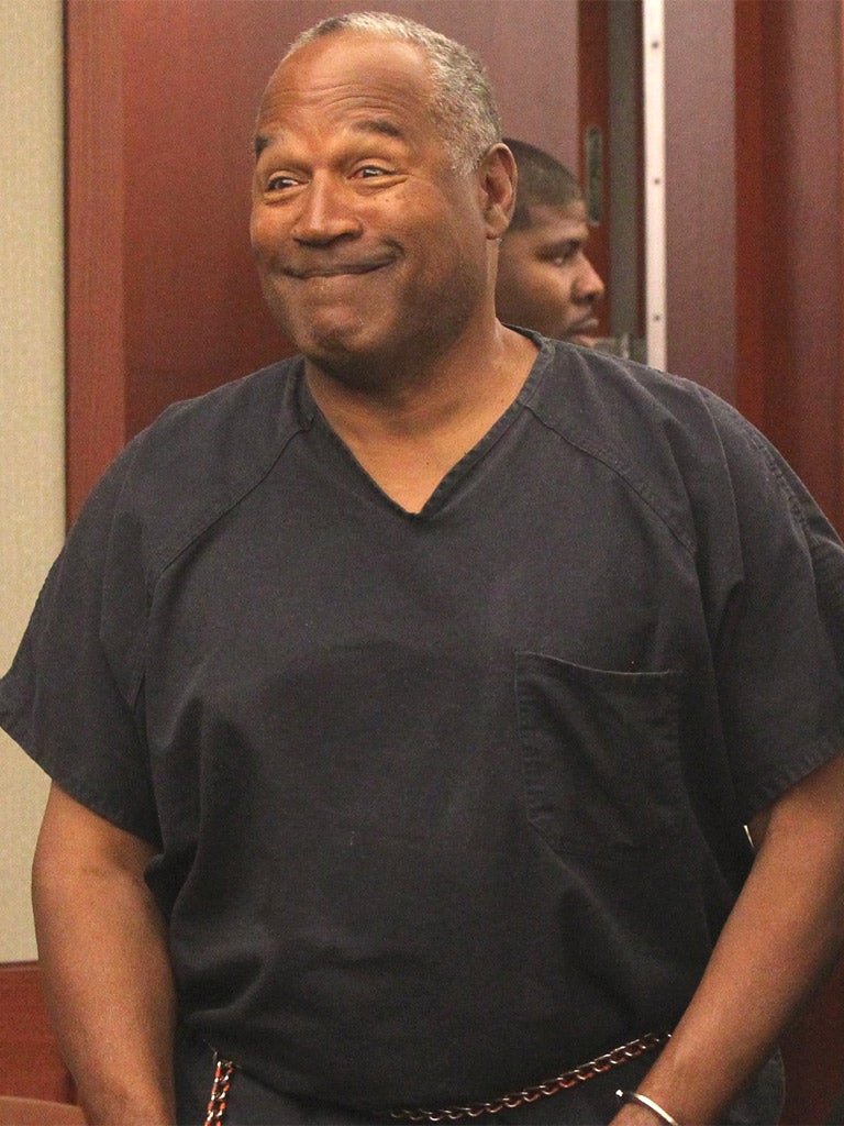 OJ Simpson enters the Clark County District Court in Las Vegas yesterday