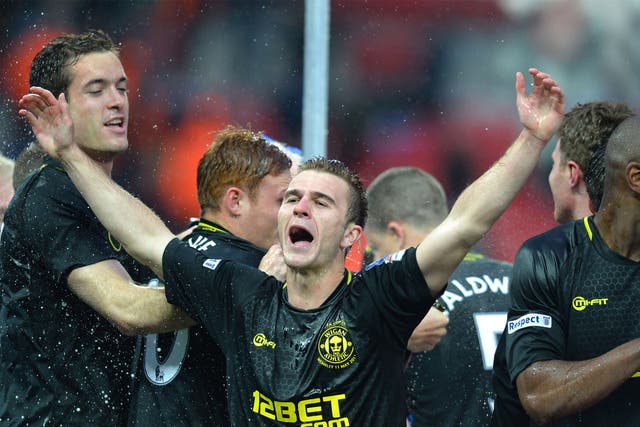 Callum McManaman celebrates Wigan’s FA Cup victory on Saturday