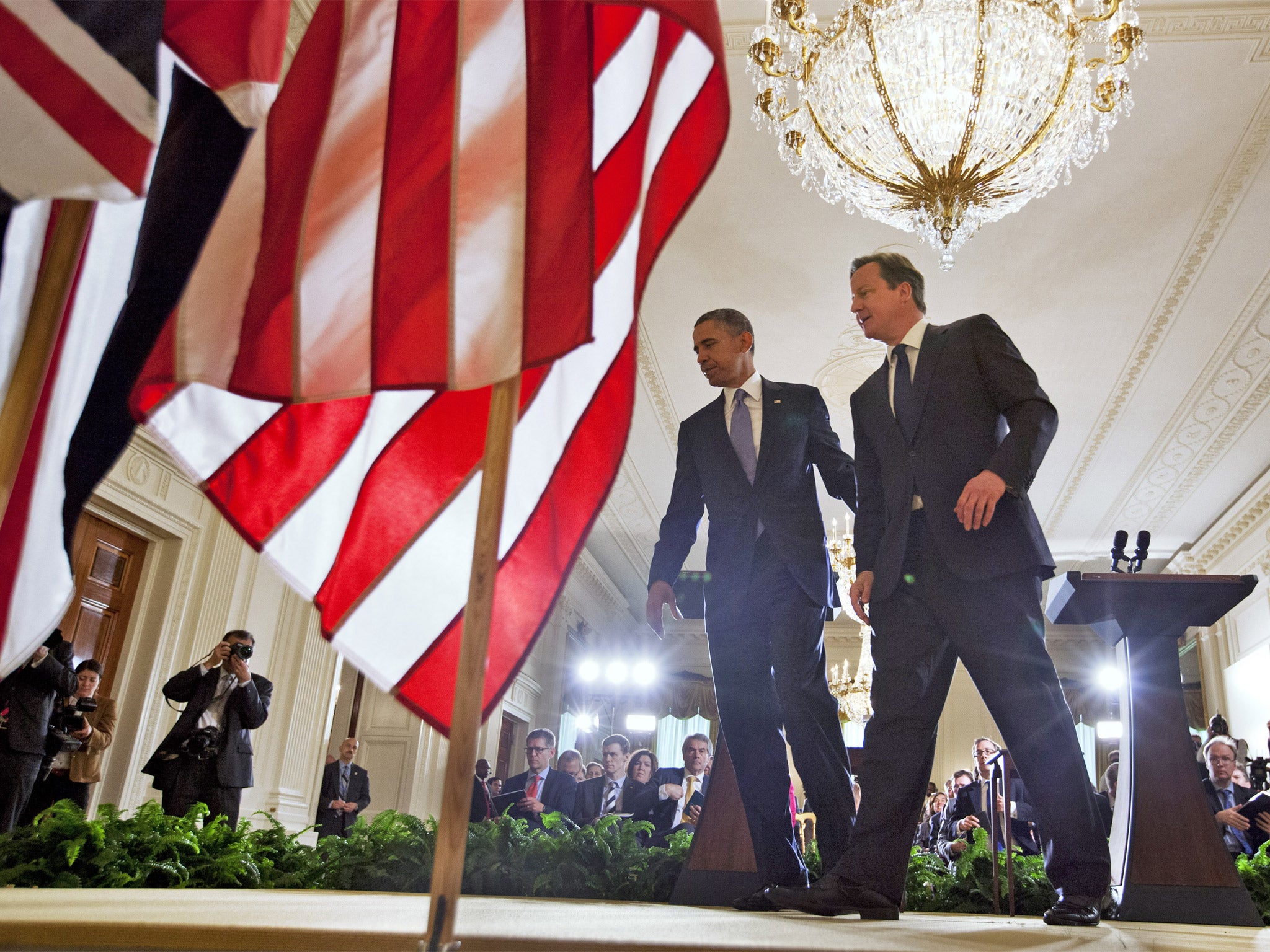Barack Obama and David Cameron leave their news conference in East Room of the White House
