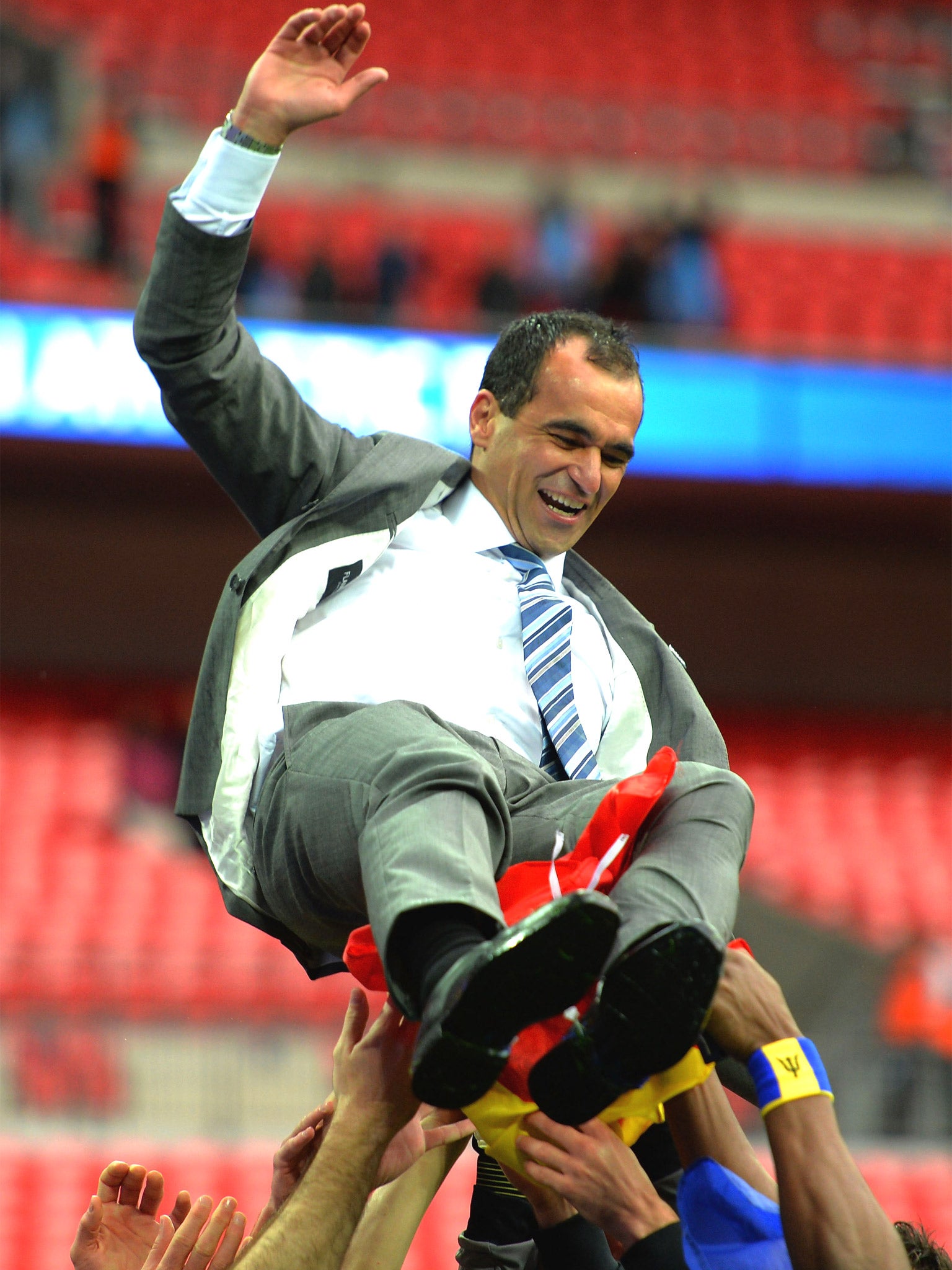 Roberto Martinez is held up by his players after their FA Cup triumph
