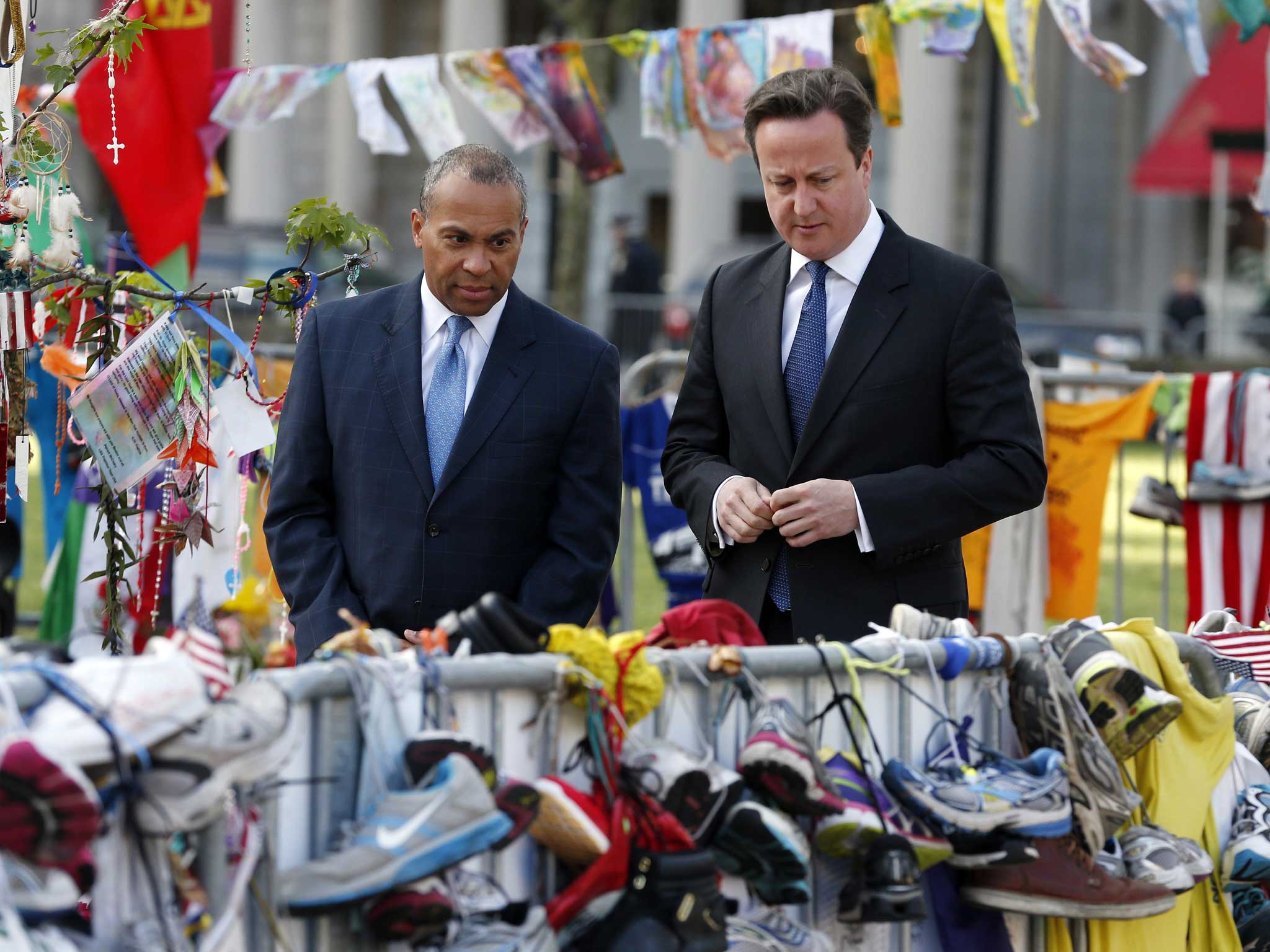 David Cameron, right, and Massachusetts Governor Deval Patrick visit the makeshift memorial to the Boston Marathon bombing victims