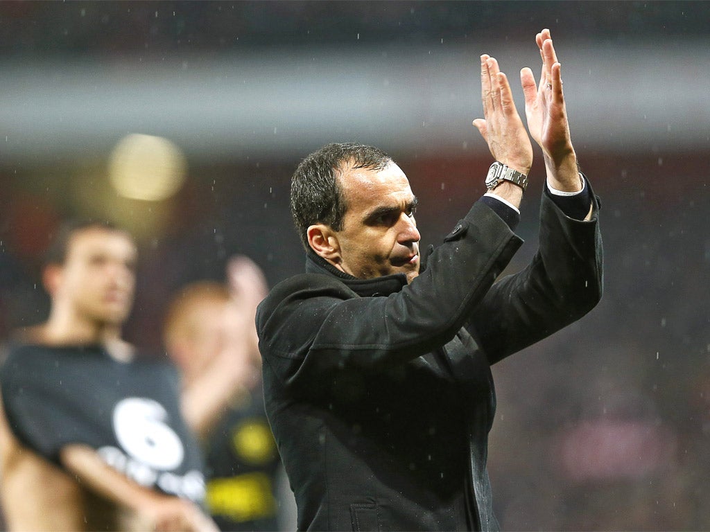 Roberto Martinez displays his appreciation to the travelling Wigan fans but is he also saying adios?