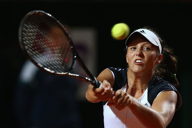 Laura Robson hits a return during her second-round elimination by Serena Williams in the main stadium at the Italian Open