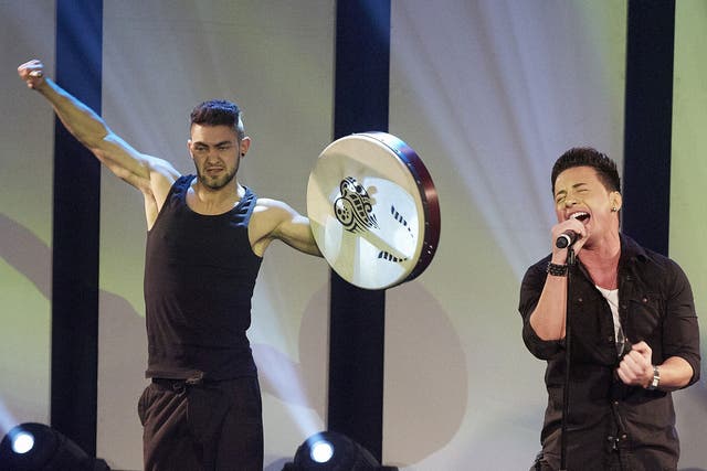 Ryan Dolan (R), who will represent Ireland in the Eurovision Song Contest 2013, performs during the fifth edition of Eurovision in Concert in Amsterdam on April 14, 2013.