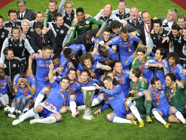 The Chelsea squad celebrate with their new trophy 