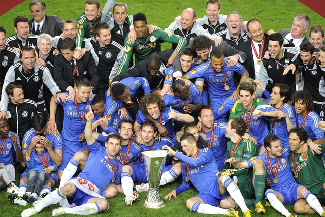The Chelsea squad celebrate with their new trophy 