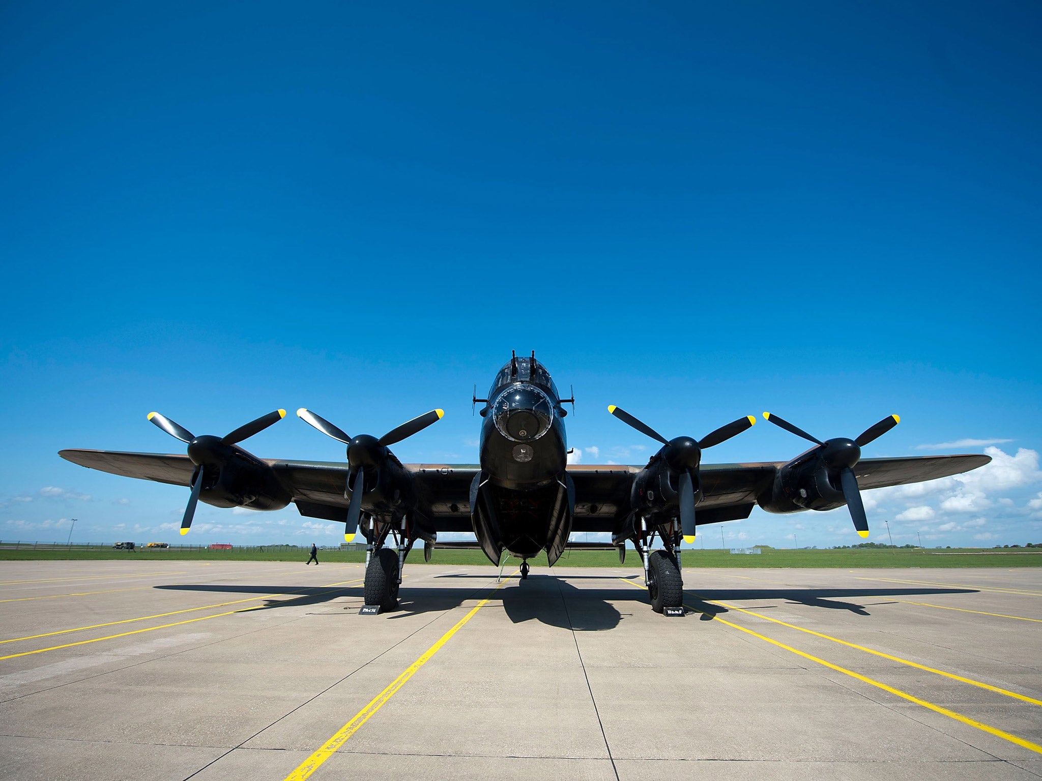 A WWII Lancaster bomber sits on the runway before take off at RAF Scampton in Lincoln.  Ladybower and Derwent reservoirs were used by the RAF's 617 Squadron in 1943 to test Sir Barnes Wallis' bouncing bomb before their mission to destroy dams in Germany's Ruhr Valley.