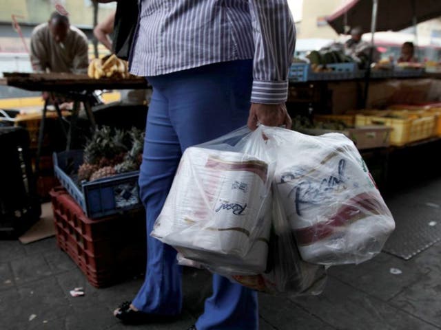 A woman who managed to find toilet paper at a private store in Caracas, Venezuela