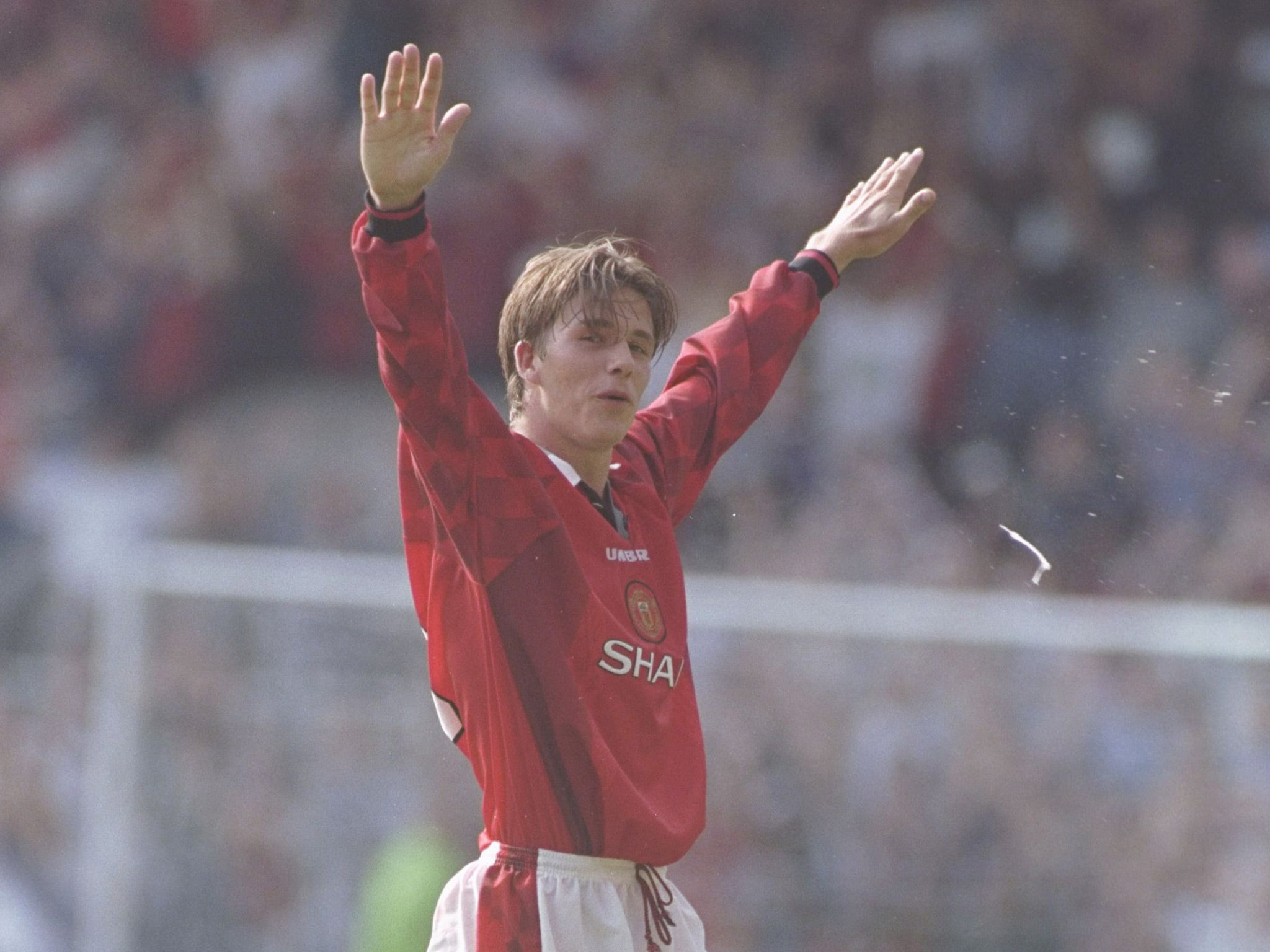 David Beckham celebrates his goal from behind the half-way line against Wimbledon in 1996