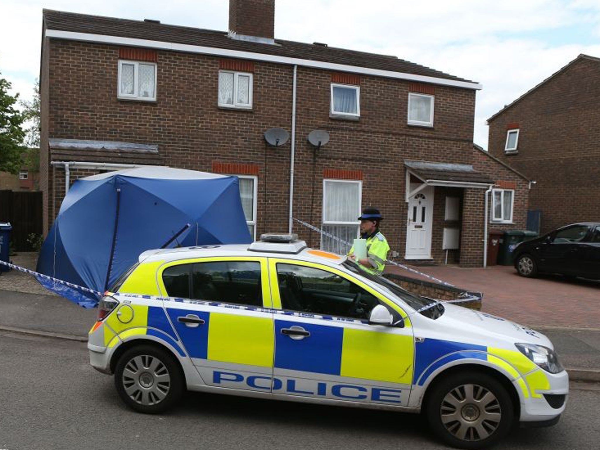 Police at the scene where the body of a two-year-old was found at a home after police were called to the address