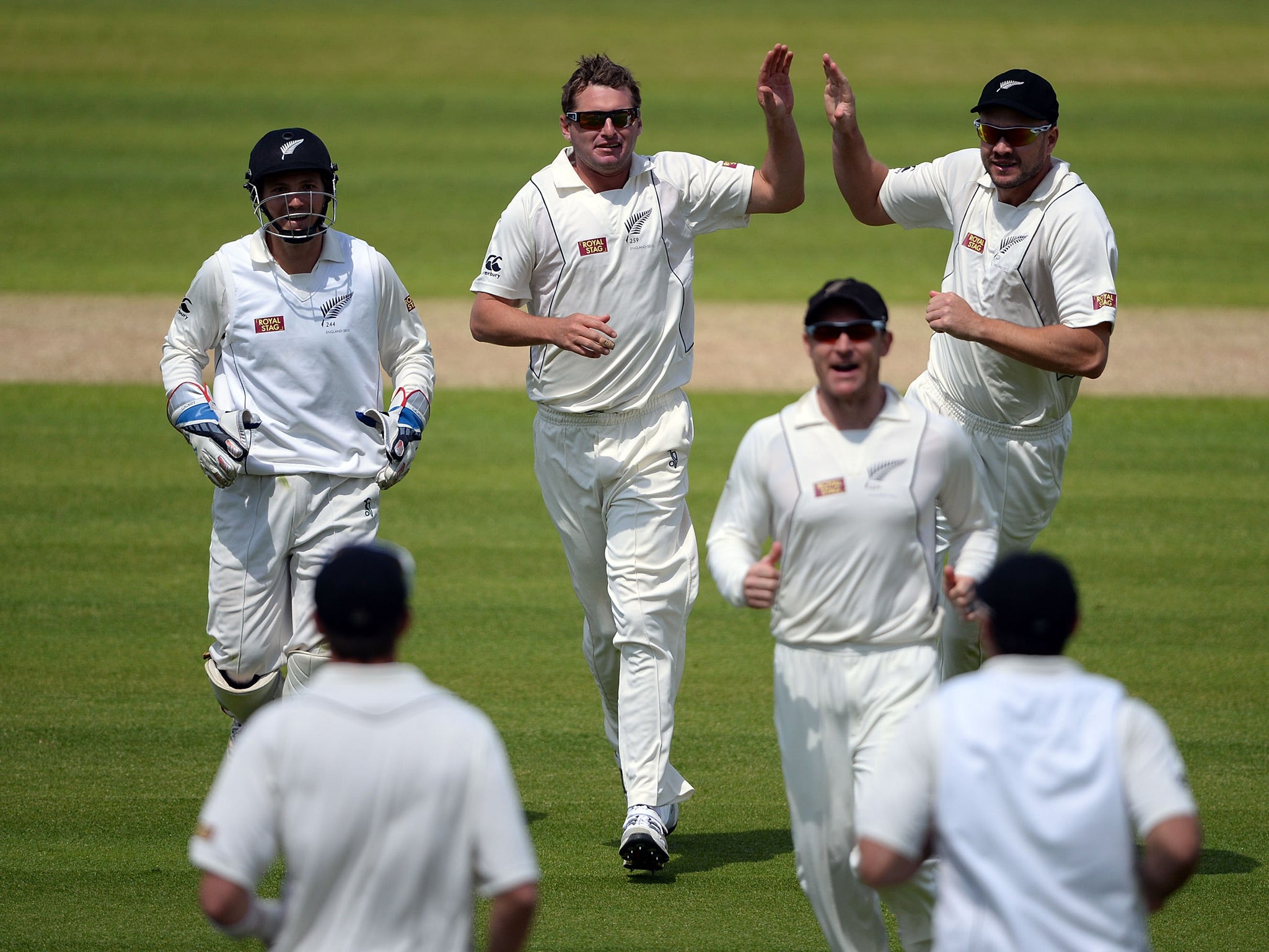 Bruce Martin of New Zealand celebrates the wicket of Nick Compton during day one of 1st Investec Test match between England and New Zealand