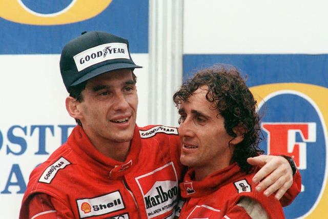Alain Prost celebrates winning the 1988 Australian Grand Prix with Ayrton Senna