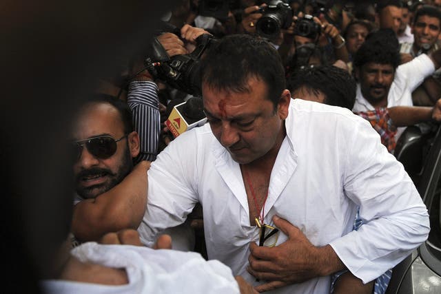 Actor Sanjay Dutt, one of Bollywood's biggest stars, has returned to prison to serve the remainder of a five-year sentence for firearms offences during the Mumbai bombings 20 years ago