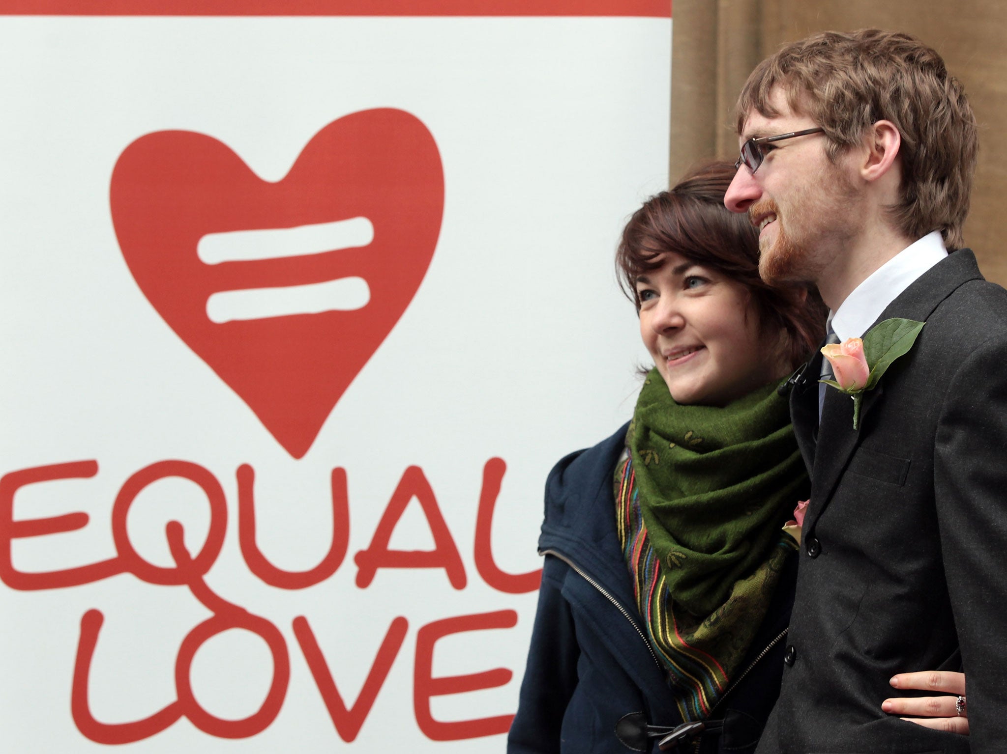 Heterosexual couple, Ian Goggin and Kristin Skarsholt pose for a photograph after being refused a civil partnership outside Bristol Register Office on November 23, 2010 in Bristol, England.