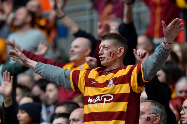 A Bradford fan watches as his team goes on to get promoted
