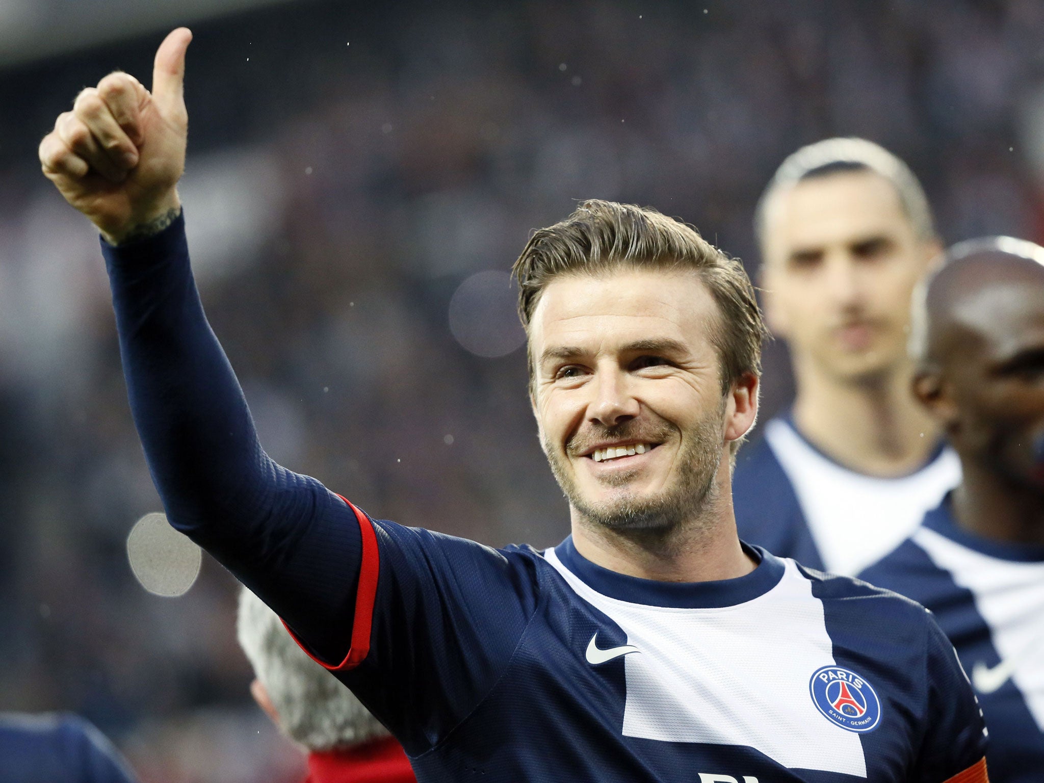 David Beckham gives the 'thumbs up' to fans