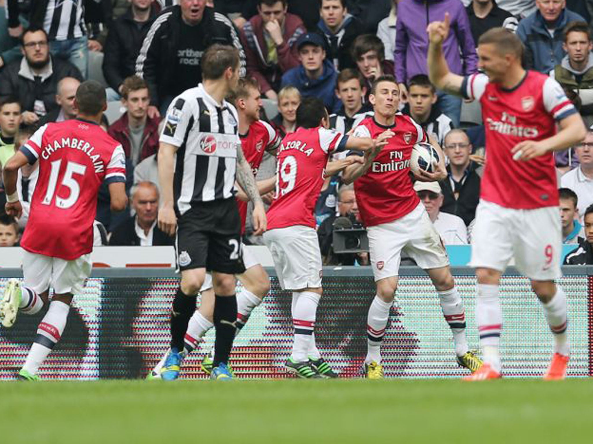 Laurent Koscielny, second right, celebrates scoring the opening goal, the goal that would ensure Champions League football for Arsenal