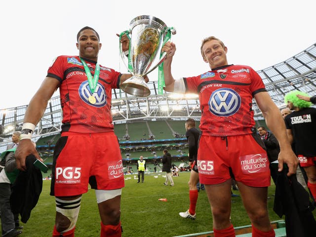 Delon Armitage, left, and Jonny Wilkinson, right, lift the Heineken Cup