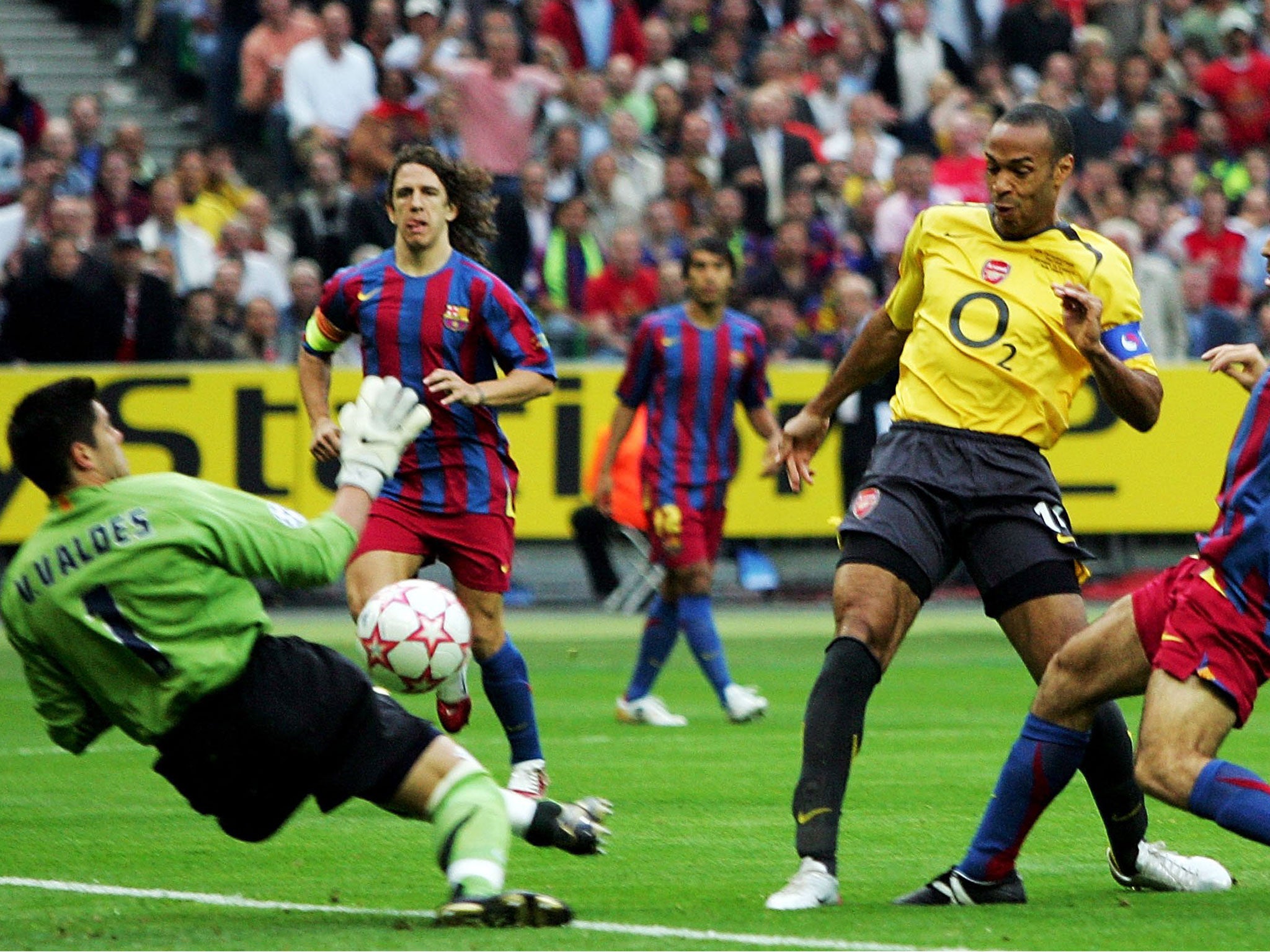 Barcelona’s Victor Valdes saves from Arsenal’s Thierry Henry during the 2006 Champions League final