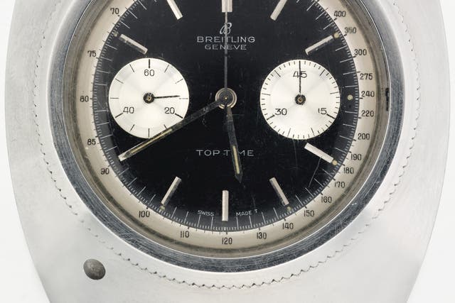 James Bond's specially modified Breitling Top Time wristwatch used in Thunderball, 1965, the watch composed of a stainless steel chronograph timepiece, by Breitling, Ref. 2002, case no. 984343, manufactured in 1962 and then modified, the black dial with a