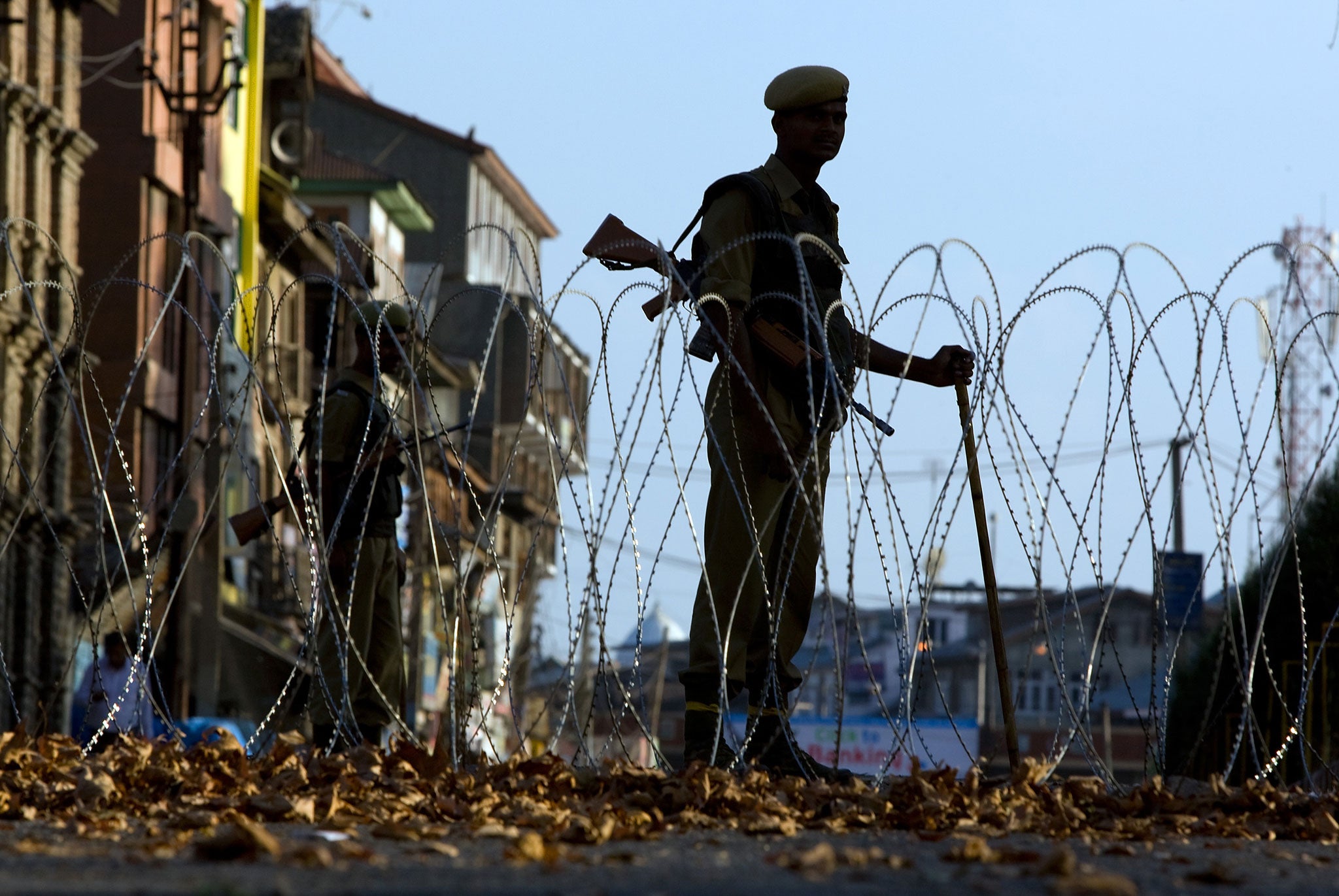 Indian security forces stand guard during a curfew October 6, 2008 in Srinagar, Kashmir, India