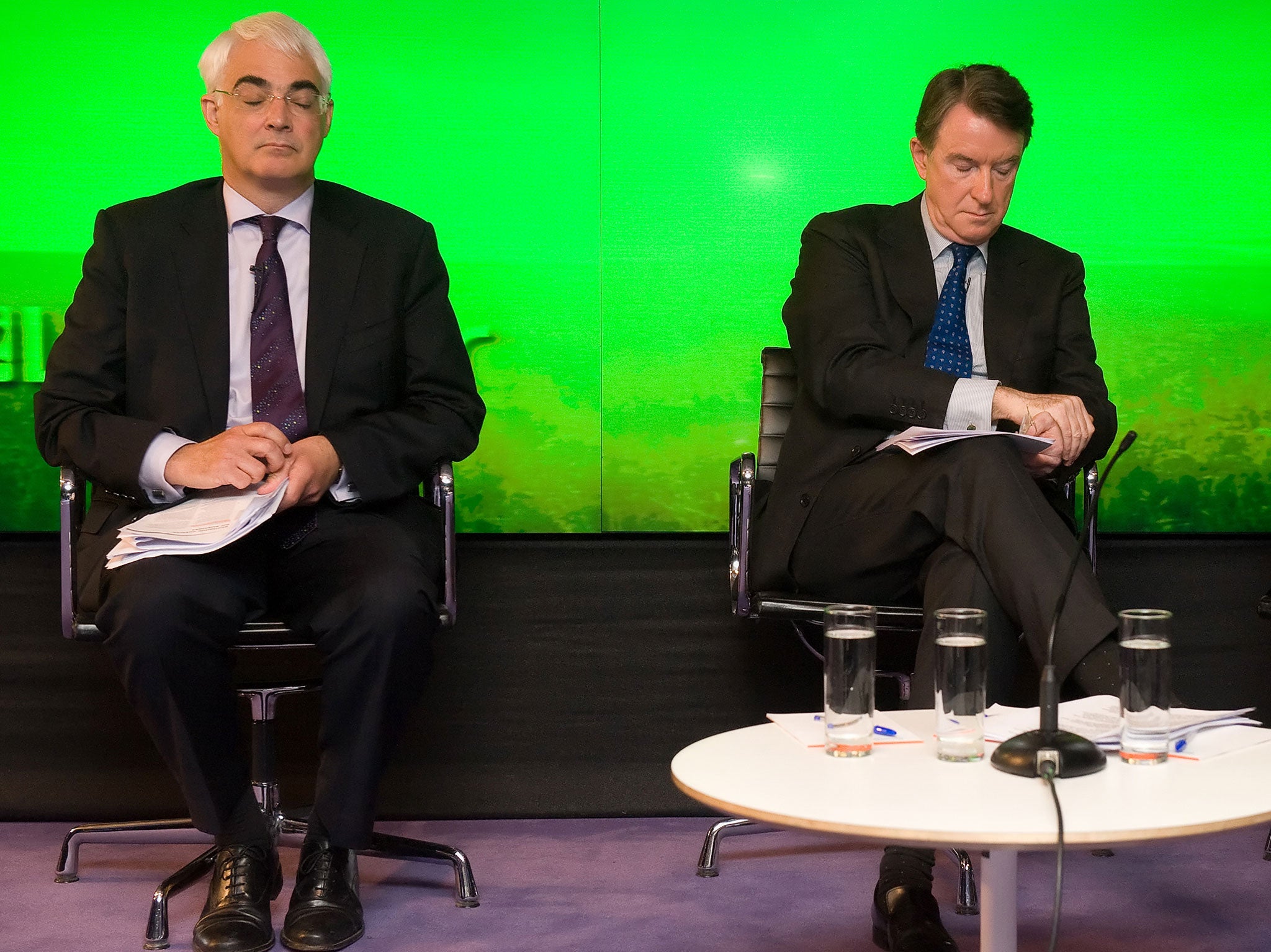 Peter Mandelson, (R) and Alistair Darling (L) speak to members of the media during a press conference on the state of the economy in central London, on April 19, 2010.