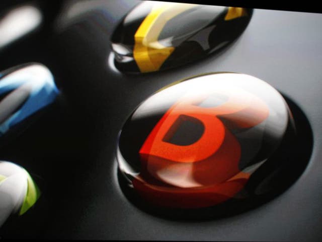 The 'B' button on the Xbox One controller is shown during a press event unveiling Microsoft's new Xbox in Redmond, Washington 