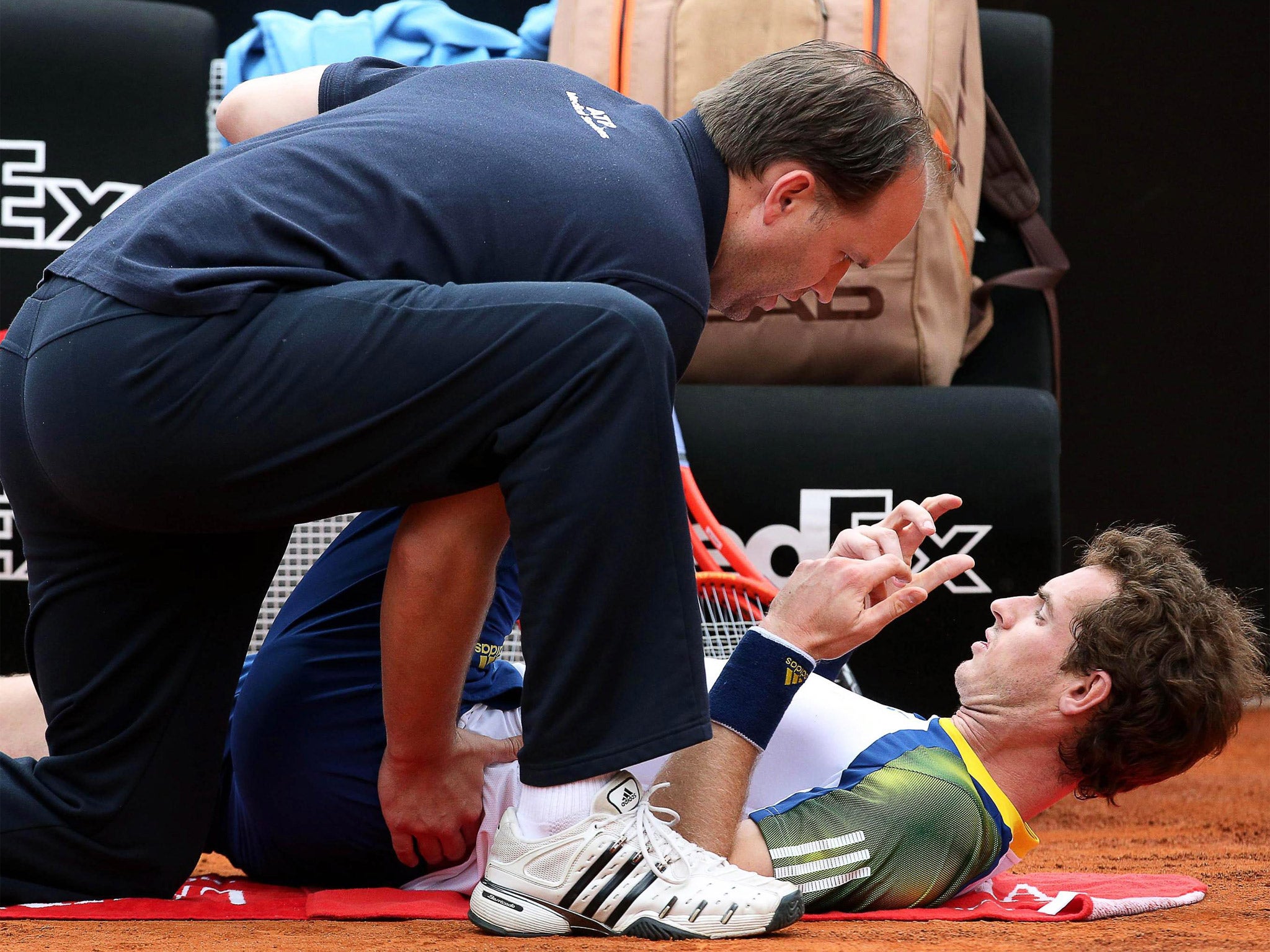Andy Murray receives treatment on his back during his game in Rome against Marcel Granollers last week