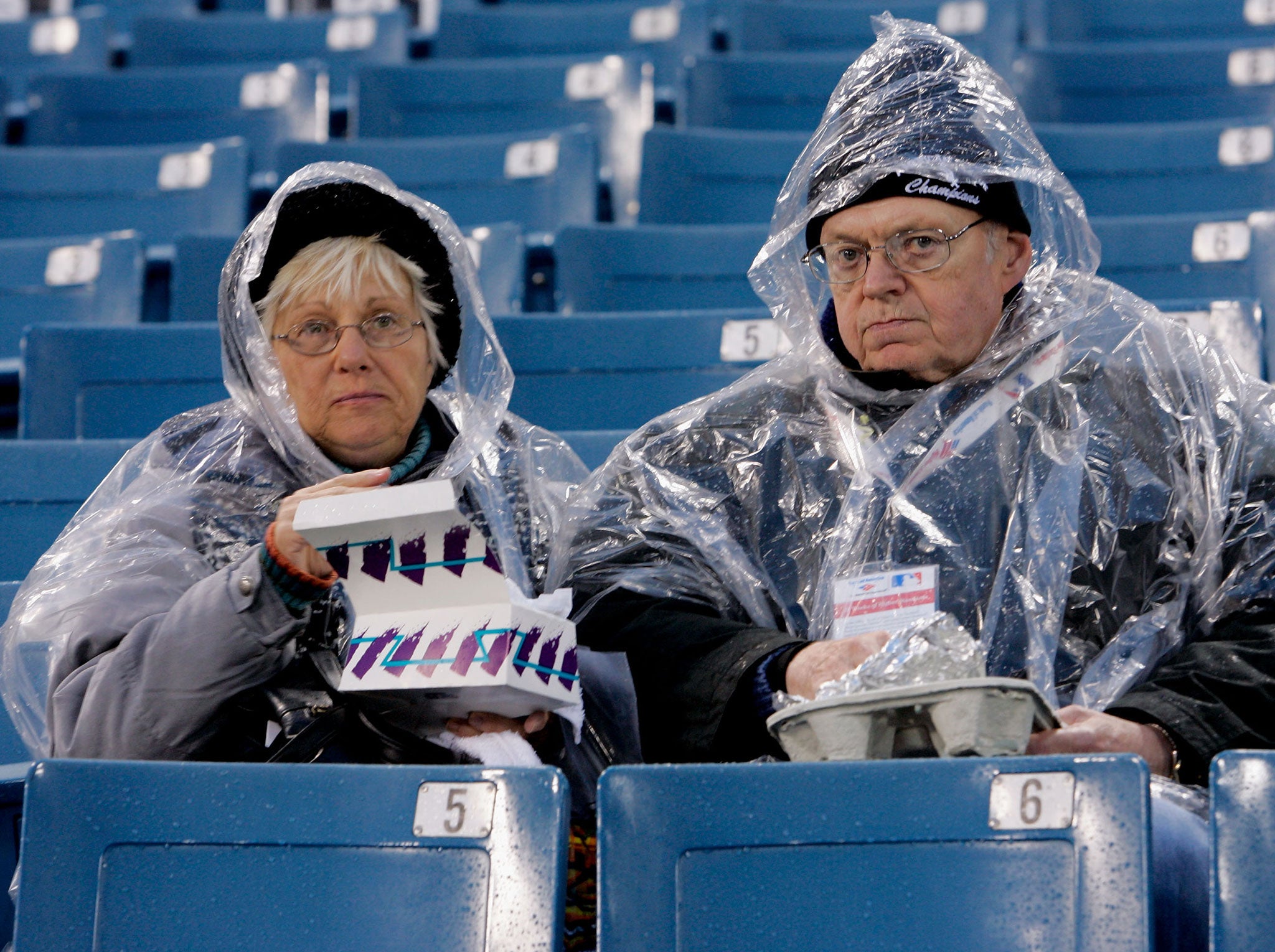 Chicago White Sox fans bundle up in rain gear before the start of Game Two of the 2005 Major League Baseball World Series between the Chicago White Sox and the Houston Astros at U.S. Celluar Field on October 23, 2005 in Chicago, Illinois.