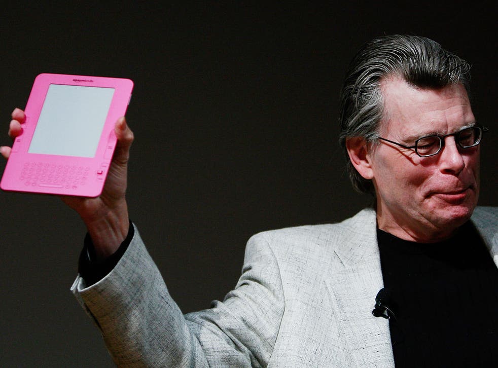 Author Stephen King holds a special pink Kindle given to him by Amazon.com founder and CEO Jeffrey P. Bezos at an unveiling event for the Amazon Kindle 2 at the Morgan Library & Museum February 9, 2009 in New York City.