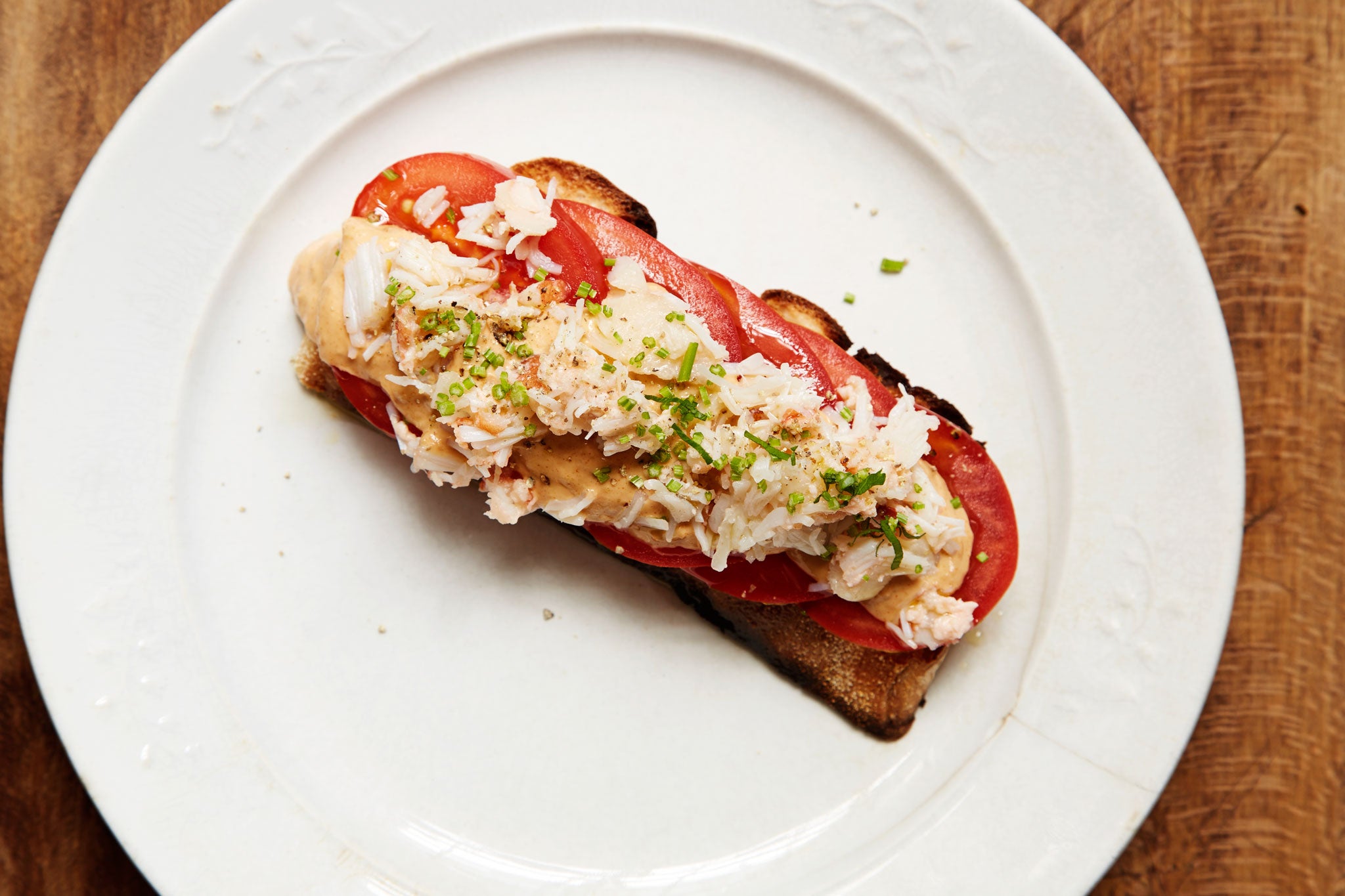 Tomatoes and crab on toast