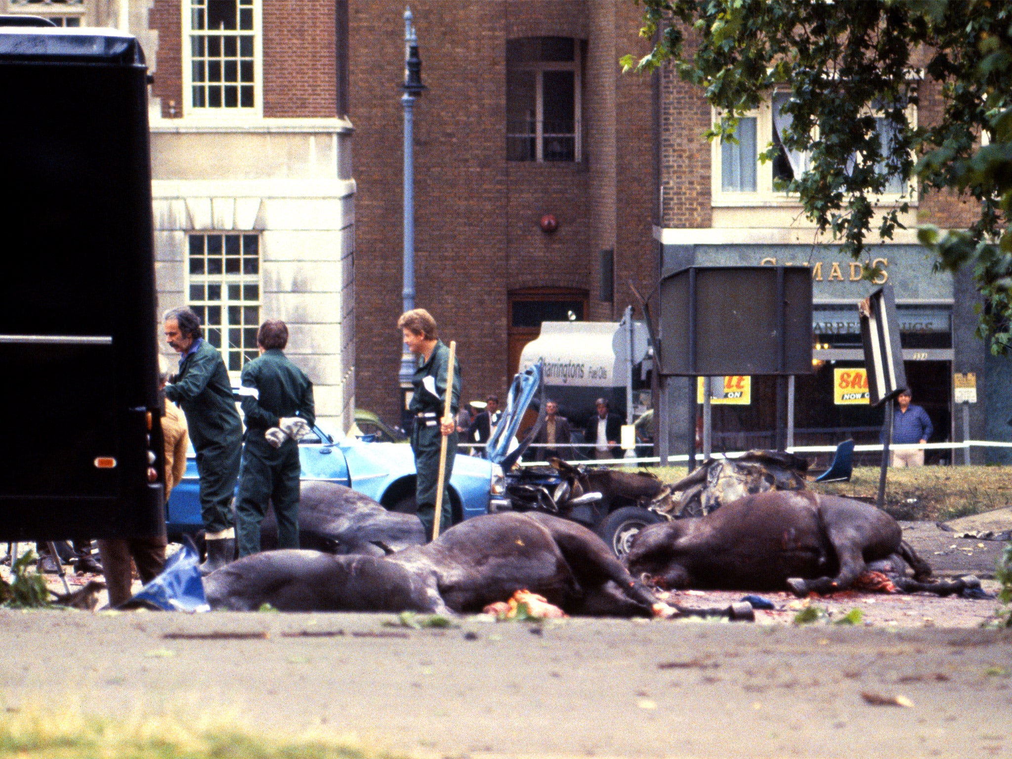 Carcasses of horses of the Household Cavalry lie in the road following the Hyde Park bomb attack